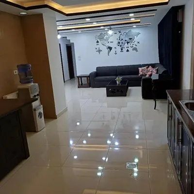 a living room with a couch and a table at Laperla family apartment 1 in Al Yādūdah