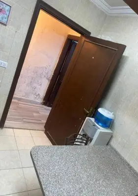 a brown door with a cooler in front of it at شقة مفروشة للايجار اسبوعي شهري سنوي طبربور in ‘Urjān al Gharbīyah