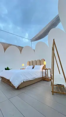 a bedroom with a large bed in a tent at منتجع برمودا Bermuda resort in Ajloun