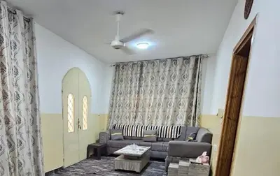 a living room with a couch and a table at Travelers Rest in Wadi Musa