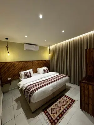 a bedroom with a large bed in a room at Jawad Hotel by Sandra in Amman