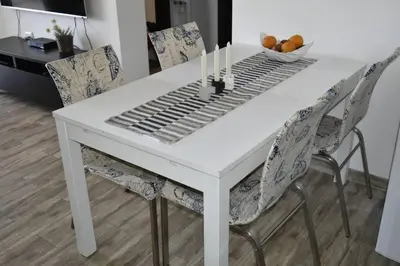 a white table and chairs with a keyboard on it at Cozy apartment Amman in Umm Uthainah