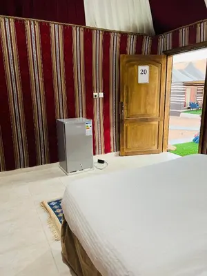 a bedroom with a bed and a wooden door at Moon rum 2 in Disah