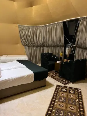 a bedroom with a bed and a couch and a rug at Moon rum 2 in Disah