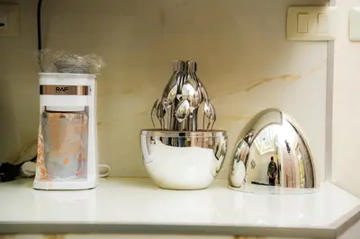 a kitchen counter with a blender and a sink at Hawari Group in Umm Uthainah