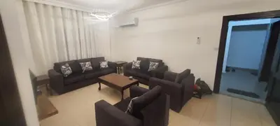 a living room with couches and a table at Furniture apartment for families 3 bedroom in Al Bunayyāt ash Shamālīyah