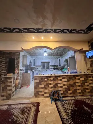 a large kitchen with a counter top in a room at Indiana Jones Home Stay in Petra