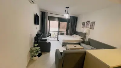 a living room with a couch and a table at Alraha village-aqaba قرية الراحة- مرسى زايد -العقبة in Aqaba