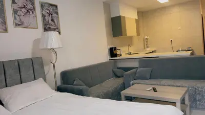 a hotel room with a bed and a couch at Alraha village-aqaba قرية الراحة- مرسى زايد -العقبة in Aqaba