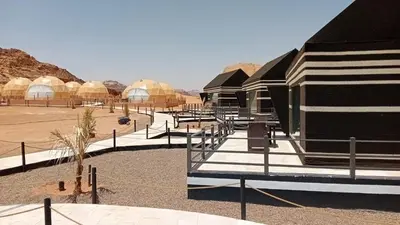 a group of domes and tents in the desert at Eagle Rum Camp in Disah