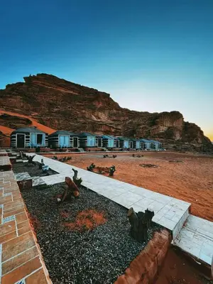 a group of houses with a mountain in the background at Mountain star in Disah