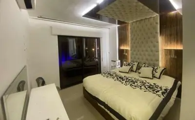 a bedroom with a large bed in a room at الأردن عمان ضاحية الأمير راشد شارع مكه in Umm Uthainah