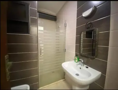 a bathroom with a sink and a toilet and a shower at الأردن عمان ضاحية الأمير راشد شارع مكه in Umm Uthainah