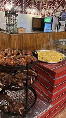 a buffet with several different types of food on display at rum luxury camp in Wadi Rum