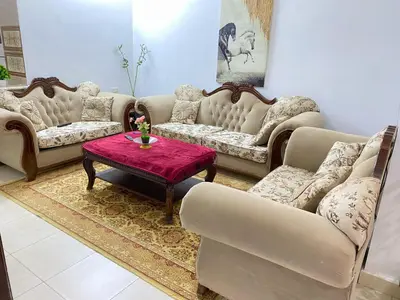 a living room with couches and a coffee table at Jerash Gate in Jerash