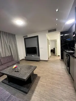 a living room with a couch and a table at central apartment for rent 22 in Amman