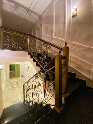 a stairway with a black and white railing at Eighth Wonders Hotel in Wadi Musa