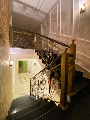 a stairway with a black and white railing at Eighth Wonders Hotel in Wadi Musa