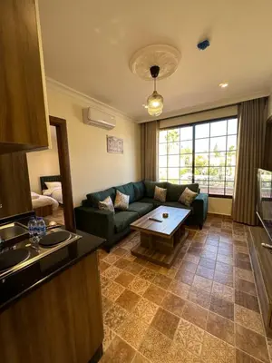 a living room with a couch and a table at 12 Antica jabalal-lwebdeh in Amman