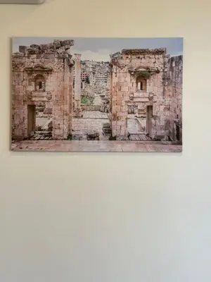a picture of a stone building on a wall at 12 Antica jabalal-lwebdeh in Amman