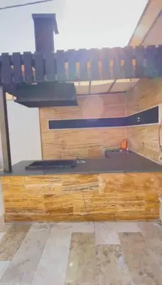 a wooden counter with a sink in a room at Private Pool - Relax Chalet Deadsea in Amman