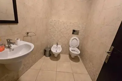 a bathroom with a sink and a toilet at Apartment the most upscale neighborhoods of Amman in Amman