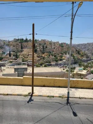an empty street with a view of a city at Loft Apartment Jabal Amman B in Amman
