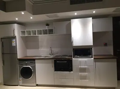 a kitchen with a sink and a stove and a refrigerator at Apartment in Amman with wow furniture in Amman
