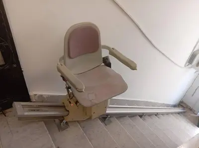 a chair sitting in a corner of a room at B Beitna in Amman