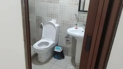 a bathroom with a toilet and a sink at Jordan River hotel in Amman
