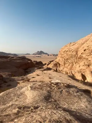 a view of a desert with rocks and a mountain at Camille WadiRum Camp in Disah