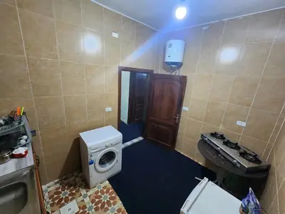 a small bathroom with a toilet and a sink at Artemis Hotel in Jerash