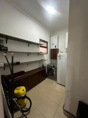 a kitchen with a white refrigerator and a stove at 8-New and Spacious Apartments Close to Market in Amman