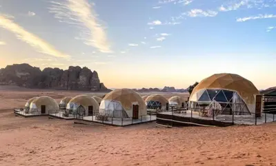 a group of domes in the desert at Ayman camp in Wadi Rum