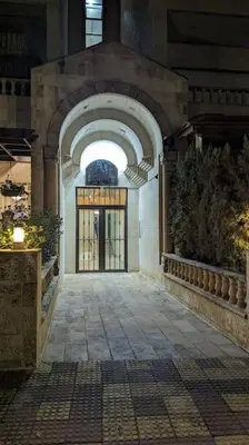 an entrance to a building with a large door at Modern Flat in Heart of Amman in Amman