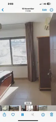 an empty room with a window and a door at Omar in Al Bunayyāt ash Shamālīyah