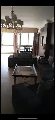 a living room with couches and a coffee table at Omar in Al Bunayyāt ash Shamālīyah