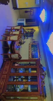 a room with a row of tables with books at Omar big house on abdun in Amman