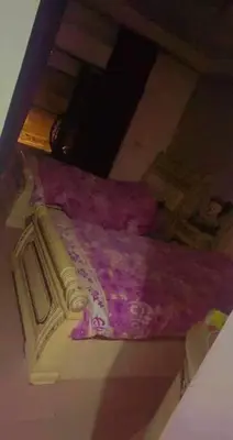 an overhead view of a bed with a purple blanket at Omar big house on abdun in Amman