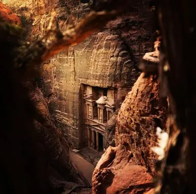 a view of a building from a cave at فندق ملتقى البتراء in Wadi Musa