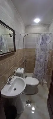 a bathroom with a toilet and a sink and a shower at amman citadle in Amman