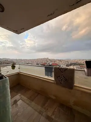 a balcony with a view of a city at كريستال in Amman