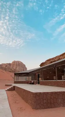 a building in the middle of the desert at Wadi Rum Camp AW in Disah