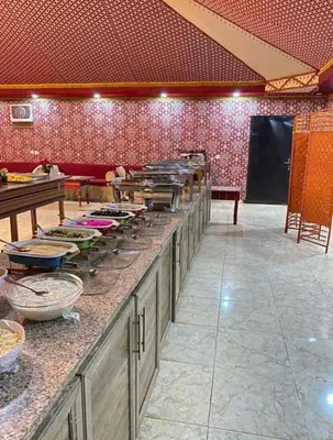 a kitchen with a long counter with alot of food on it at Welcome to Wadi Rum in Wadi Rum