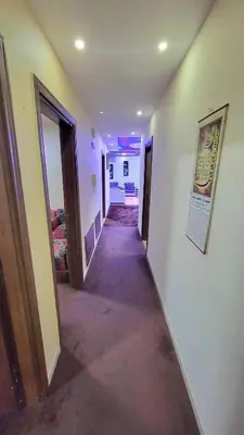 a hallway of a house with at water house in Al Quwaysimah