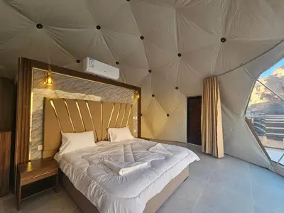 a bedroom with a large bed in a tent at wadi Rum Mohammed in Wadi Rum