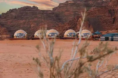 a group of domes in the desert near a mountain at wadi Rum Mohammed in Wadi Rum