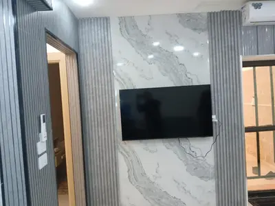 a flat screen tv on a wall at شقق السعادة 1 in Amman