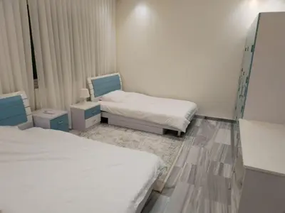 a room with two beds in a hospital room at Amman Sweet-Home - 2 bedrooms Apartment in Amman