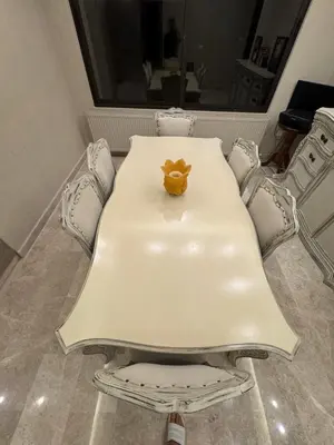 a table with a teddy bear sitting on top of it at Bargos Cave in Amman